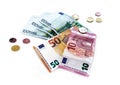 Collage of coins and euro currency banknotes on a white background Royalty Free Stock Photo