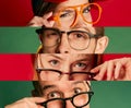 Collage. Cropped image of human eyes in glasses emotionally looking at camera over multicoloured background. Narrow Royalty Free Stock Photo