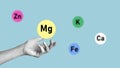 Collage with hand Choosing Magnesium from Icons of minerals and macronutrients. Selection of foods with trace elements Royalty Free Stock Photo