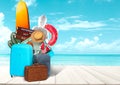 Collage of luggage for travel in front of ocean view