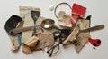 A collage of miscellaneous objects arranged on a flat surface. Items include a