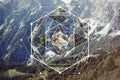 Collage with the mountains and forest and the sacred geometry symbol Royalty Free Stock Photo