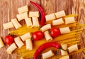 Collage Pasta with cherry tomatoes and other ingredients on wooden table background Royalty Free Stock Photo