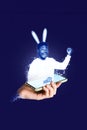 Collage phone projection springtime concept funny young guy wear handmade bunny ears fists up celebrate april tradition