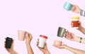 Collage with photos of people holding different cups on background, closeup