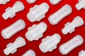 Collage of Sanitary pad or Menstrual Pads for light, regular and heavy flow on a red background