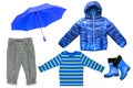 Collage set of children clothes. Denim jeans or pants, rubber boots, a shirt and a rain jacket and umbrella for child boy isolated