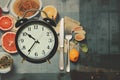 Collage style, interval fasting concept. Dietary pattern issues. Nutriciology. clock and food, AI generated Royalty Free Stock Photo