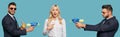 Collage of surprised businesswoman pointing with finger at herself and businessman with toy water gun