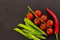 Collage vegetable set pod pea green branch tomato chili pepper asia recipe black background