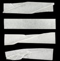 Collage white pieces of scotch tape isolated on a black background.  set stripes of masking tape. Insulating tape Royalty Free Stock Photo