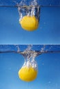 Collage Whole lemon dropped in water against gradient