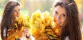 Collage, young beautiful woman with a bouquet of maple leaves