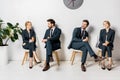 collage of young business people holding paper cups and waiting on chairs Royalty Free Stock Photo