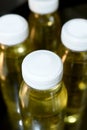 collagen bottles on black background