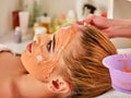 Collagen face mask. Facial skin treatment. Woman receiving cosmetic procedure.