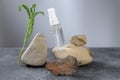 Collagen gel in unbranded bottle on natural rocks