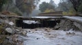 A collapsed bridge weakened by continual heavy rainfall from atmospheric rivers