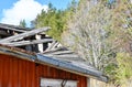 Collapsed roof of an abandoned old wooden sauna in the countryside Royalty Free Stock Photo