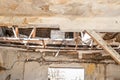 Collapsed roof of the total damaged domestic house indoor from natural disaster or catastrophe