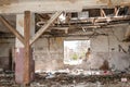 Collapsed roof of the total damaged domestic house indoor from natural disaster or catastrophe Royalty Free Stock Photo