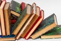 Collapsed row of old books with ancient bindings Royalty Free Stock Photo