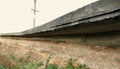 The collapsed soil is beneath the concrete pavement