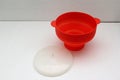 Collapsible red silicone container for microwave popcorn