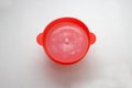 Collapsible red silicone container for microwave popcorn