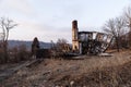 Collapsing, Abandoned House on Barren Street at Sunset