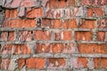 Collapsing old wall of red broken bricks, background and texture Royalty Free Stock Photo