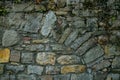 The collapsing stone arch is laid with bricks to protect against the destruction of the building.