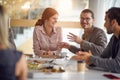 Colleagues  at a break.Business people enjoying a meal at lunch break Royalty Free Stock Photo