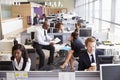 Colleagues busy working at desks in an open plan office Royalty Free Stock Photo