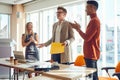 Colleagues congratulate to young lecturer after successful lecture in the conference room. Business, people, company Royalty Free Stock Photo