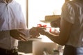 Colleagues congratulating coworker receiving gift box and birthd Royalty Free Stock Photo