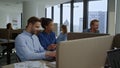 Colleagues discussing strategy in office. Businesswoman talking with businessmen Royalty Free Stock Photo