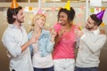 Colleagues enjoying birthday party with champagne Royalty Free Stock Photo