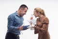 Colleagues fighting each other with paper in fists