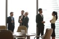 Colleagues having casual talk during work break in office Royalty Free Stock Photo