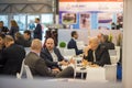 Colleagues having a drink attending the Amper event at the convention trade center in Brno. BVV Brno Exhibition center. Czech