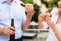 Colleagues having sausages and beer after work