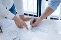 Colleagues interior designer Corporate Achievement Planning Design on blueprint Teamwork Concept with compasse