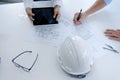 Colleagues interior designer Corporate Achievement Planning Design on blueprint Teamwork Concept with compasse