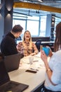 Colleagues laughing at the office meeting