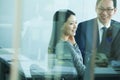 Colleagues Meeting in Conference Room, Shot Through Glass Royalty Free Stock Photo