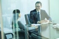 Colleagues Meeting in Conference Room, Shot Through Glass Royalty Free Stock Photo