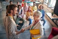 Colleagues are shaking hands after a well done presentation in a conference room. Employees, office, work Royalty Free Stock Photo