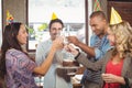 Colleagues toasting with champagne at birthday party Royalty Free Stock Photo
