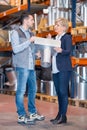 colleagues in warehouse looking at product